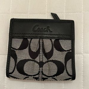 Coach black leather and canvas snap wallet.